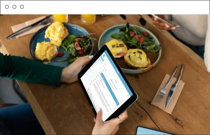 Tablet showing the Chefgaa dashboard next to a breakfast table