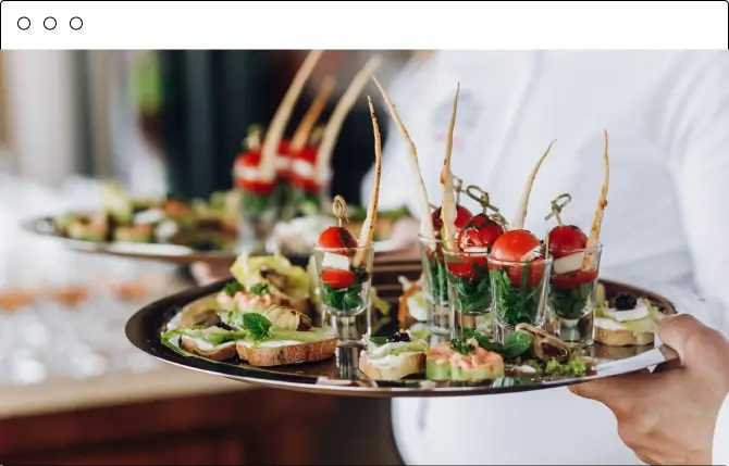 Waiter carrying a tray of canape appetizers